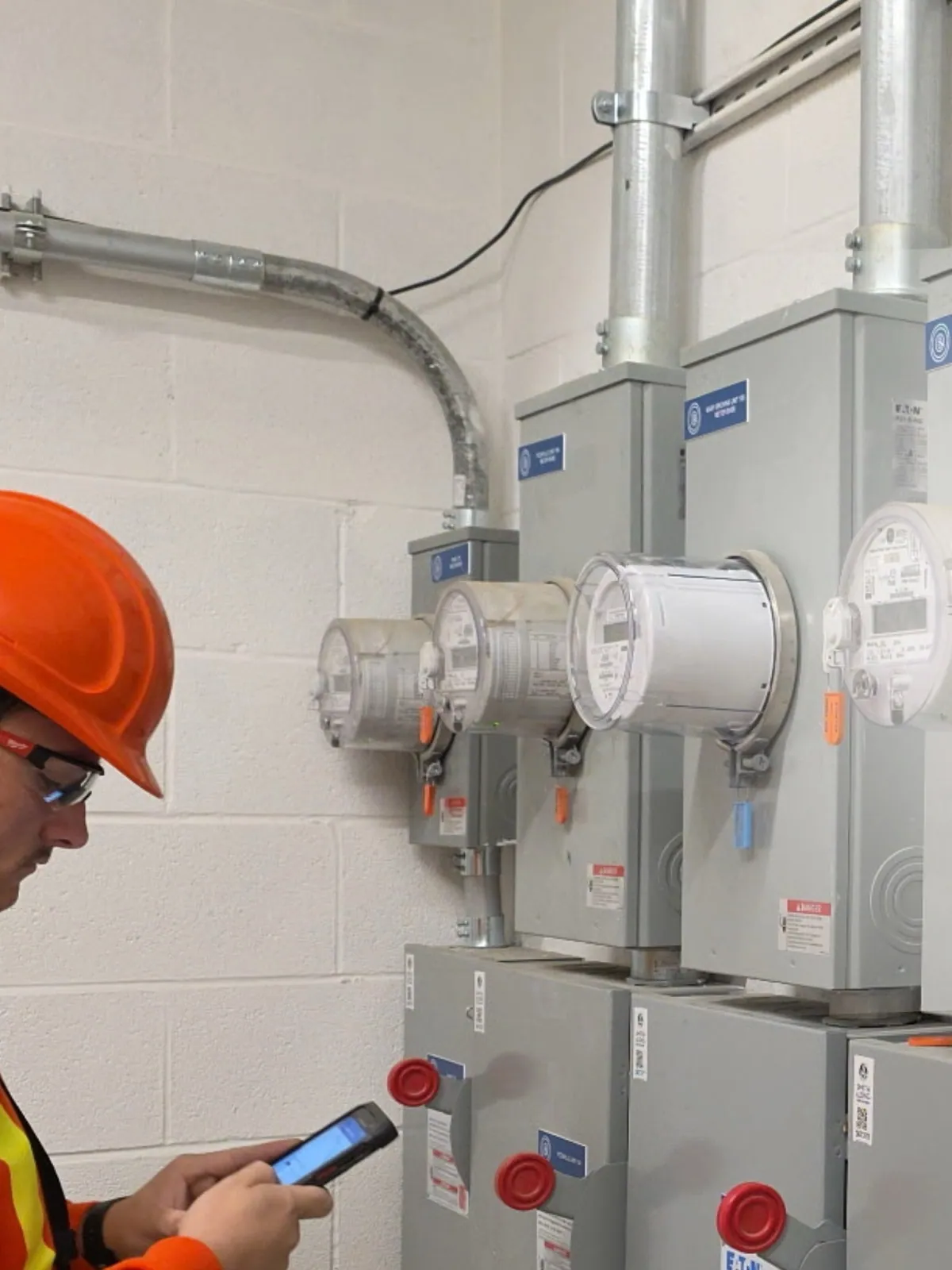 Veteran Electric worker inspecting metering equipment